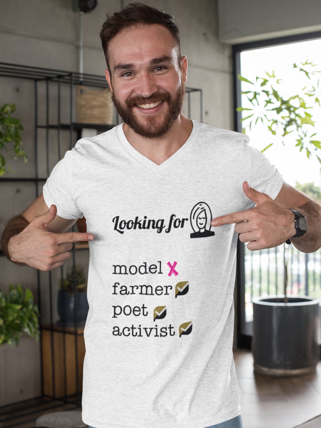 man pointing at his heathered t-shirt